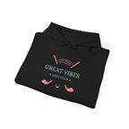 A black golf hoodie laid flat with the text 'GREAT VIBES' and 'GOLF CLUB' printed on the front.