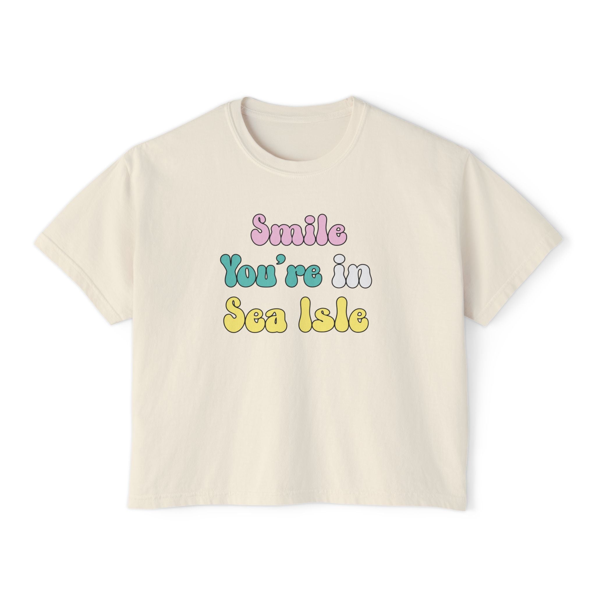 Beige t-shirt with 'Smile You're in Sea Isle' text on a white background