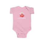 Pink baby onesie with a fish graphic and text on a white background