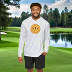 A man wearing a white long-sleeved golf performance hoodie that says "It's A Bad Day To Be A Tree". A great gift for bad golfers. 