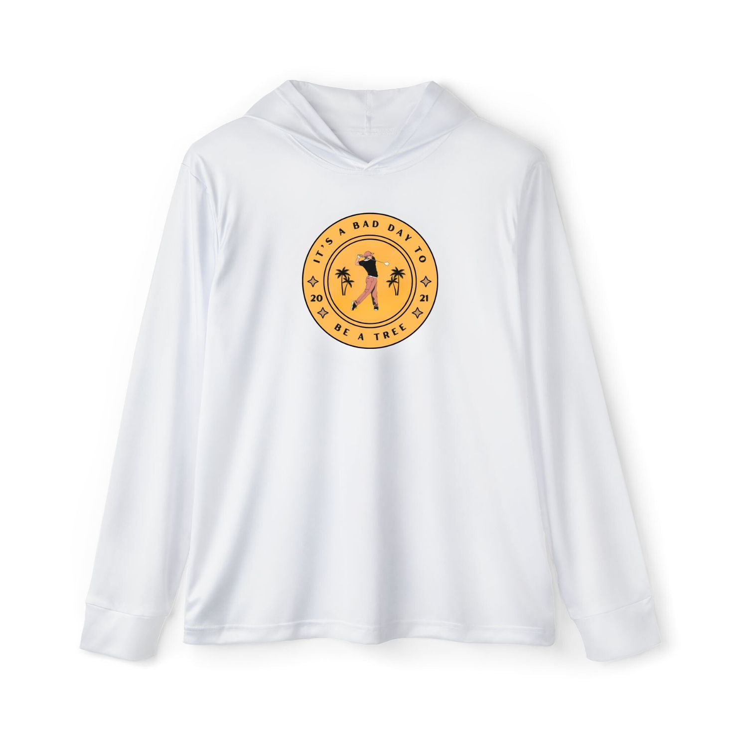 A man wearing a white long-sleeved hoodie with text and graphic print in the center, standing on a golf course.