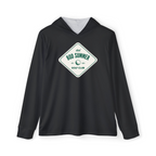 A man wearing a black golf performance hoodie with a text logo on the front standing on a golf course.