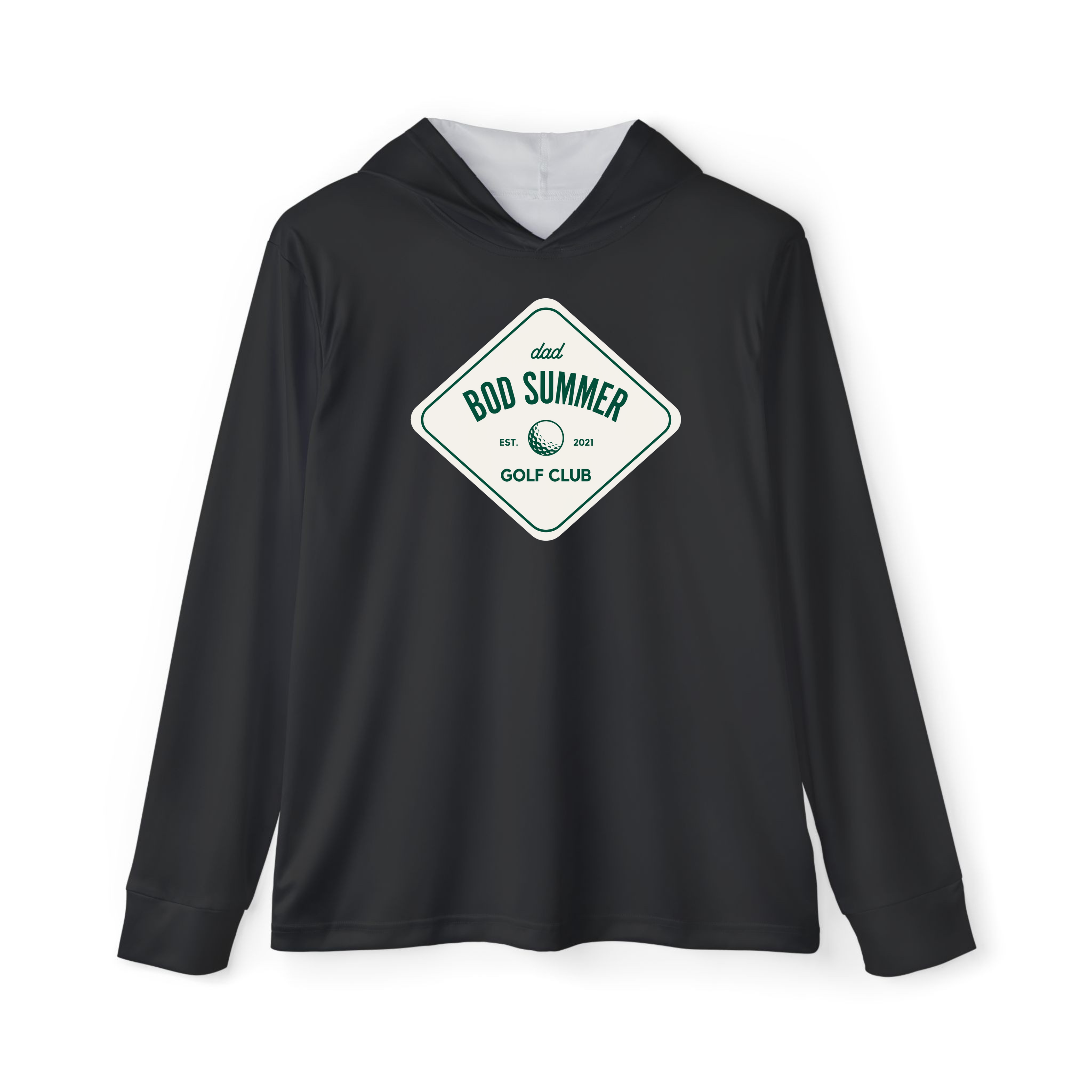 A man wearing a black golf performance hoodie with a text logo on the front standing on a golf course.